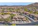 Beautiful neighborhood aerial showcasing desert landscape, community parking and nearby mountains in the distance at 2118 W Hunter Ct # 136, Phoenix, AZ 85085