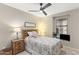 Comfortable bedroom with a full-sized bed, nightstand, and cozy decor at 2118 W Hunter Ct # 136, Phoenix, AZ 85085