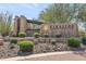 Elegant entrance to Fireside at Norterra by Del Webb, showcasing lush landscaping at 2118 W Hunter Ct # 136, Phoenix, AZ 85085