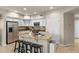 Modern kitchen featuring an island, white cabinets, stainless steel appliances, and an undermount sink at 2118 W Hunter Ct # 136, Phoenix, AZ 85085