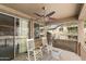 Relaxing covered patio with ceiling fan and comfortable rocking chairs overlooking the community landscaping at 2118 W Hunter Ct # 136, Phoenix, AZ 85085