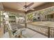 Relaxing covered patio with comfortable rocking chairs, offering a great space to unwind outdoors at 2118 W Hunter Ct # 136, Phoenix, AZ 85085