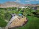 Aerial view of playground and recreational area surrounded by green space and walking paths at 21407 W Hubbell St, Buckeye, AZ 85396