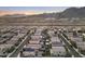 Panoramic aerial shot displays a desert community with mountain views, showing diverse homes and desert landscape at 21407 W Hubbell St, Buckeye, AZ 85396