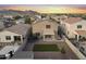 Expansive backyard with synthetic grass, trampoline, gravel landscaping, and covered patio for outdoor entertaining at 21407 W Hubbell St, Buckeye, AZ 85396