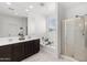 Bathroom showcasing a double vanity, bathtub, and separate shower, providing a functional and modern space at 21407 W Hubbell St, Buckeye, AZ 85396
