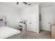 Well-lit bedroom with a vanity area, creating a serene and organized space for relaxation and personal care at 21407 W Hubbell St, Buckeye, AZ 85396
