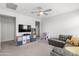 Functional bonus room, with comfortable seating, storage solutions, and a media area, perfect for Gathering entertainment at 21407 W Hubbell St, Buckeye, AZ 85396