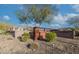 Sienna Hills Swim Club entrance sign set behind a brick wall with desert landscaping at 21407 W Hubbell St, Buckeye, AZ 85396