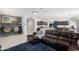 Cozy living area flows into the kitchen, and home office space, creating a comfortable and connected living space at 21407 W Hubbell St, Buckeye, AZ 85396