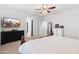 A main bedroom with a TV, dresser, and a decorative mirror, offering a relaxing retreat at 21407 W Hubbell St, Buckeye, AZ 85396