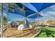 Modern playground with climbing features and sunshade, located near picnic tables and green space at 21407 W Hubbell St, Buckeye, AZ 85396