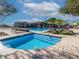 Inviting community pool and spa area offers a refreshing retreat with ample seating and shade at 21407 W Hubbell St, Buckeye, AZ 85396