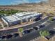 Aerial view of school with dedicated parking, desert landscaping and mountain views in the background at 21407 W Hubbell St, Buckeye, AZ 85396