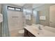 Bright bathroom with a shower-tub combo, white tiles, and a dark wood vanity at 2181 E 27Th Ave, Apache Junction, AZ 85119