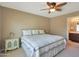 Comfortable bedroom boasts ceiling fan and bright light at 2181 E 27Th Ave, Apache Junction, AZ 85119