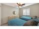 Cozy bedroom with two twin beds, neutral walls, and a ceiling fan at 2181 E 27Th Ave, Apache Junction, AZ 85119