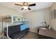 Bedroom with a bunk bed, a futon and a desk with a black office chair at 2181 E 27Th Ave, Apache Junction, AZ 85119