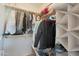 Organized closet featuring shelves and rods, with a variety of clothing and accessories at 2181 E 27Th Ave, Apache Junction, AZ 85119