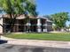 Exterior of the well-maintained community clubhouse on a manicured lawn, trees, and nearby parking at 2181 E 27Th Ave, Apache Junction, AZ 85119