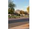 Peaceful community street view featuring desert landscaping, distant mountain, and homes at 2181 E 27Th Ave, Apache Junction, AZ 85119