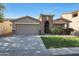 Charming single-Gathering home with stone accents, manicured lawn, and a welcoming entrance at 2181 E 27Th Ave, Apache Junction, AZ 85119