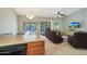 Open-concept living space with kitchen view, casual seating, and bright natural light at 2181 E 27Th Ave, Apache Junction, AZ 85119