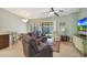 Open-concept living room with sliding door to patio and casual dining area at 2181 E 27Th Ave, Apache Junction, AZ 85119