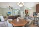 Bright living space with ceiling fan open to the kitchen and casual dining at 2181 E 27Th Ave, Apache Junction, AZ 85119