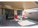 Outdoor patio area with table and chairs, ideal for dining or relaxation at 2181 E 27Th Ave, Apache Junction, AZ 85119