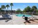 Community pool with lounge seating and mature landscaping for a relaxing atmosphere at 2181 E 27Th Ave, Apache Junction, AZ 85119