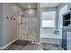 Bright bathroom featuring a walk-in shower and relaxing soaking tub at 2210 W Goldmine Mountain Dr, Queen Creek, AZ 85144