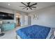 Spacious primary bedroom with ensuite bathroom and stylish furnishings at 2210 W Goldmine Mountain Dr, Queen Creek, AZ 85144