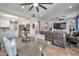 View of the living room from a spacious dining area and kitchen at 2210 W Goldmine Mountain Dr, Queen Creek, AZ 85144