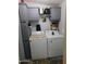 Laundry area with washer and dryer, overhead cabinets and storage, efficient and functional at 2400 E Baseline Ave # 153, Apache Junction, AZ 85119