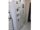 Modern white refrigerator with water dispenser and decorative magnets in the kitchen at 2400 E Baseline Ave # 153, Apache Junction, AZ 85119