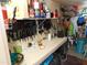 A well-organized storage room or workshop area with an array of tools and supplies on shelves at 2400 E Baseline Ave # 153, Apache Junction, AZ 85119