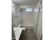 Well-lit bathroom featuring a shower-tub combo with a white tile surround and neutral-toned flooring at 2402 E 5Th St # 1428, Tempe, AZ 85288