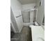 Clean bathroom featuring a shower with glass doors, toilet, vanity, and tile flooring at 2402 E 5Th St # 1428, Tempe, AZ 85288