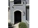 The exterior entry features an arched entryway and a warm exterior light at 2402 E 5Th St # 1428, Tempe, AZ 85288