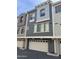 Charming townhome exterior with a two-car garage and stucco finish at 2402 E 5Th St # 1428, Tempe, AZ 85288