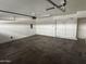 Large two-car garage featuring painted walls, an automatic door opener, and storage opportunities at 2402 E 5Th St # 1428, Tempe, AZ 85288