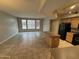 Bright living space with tile flooring, kitchen island, and natural light from large windows at 2402 E 5Th St # 1428, Tempe, AZ 85288