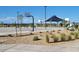 Outdoor basketball court and covered picnic tables enhance community amenities at 25207 N 183Rd Dr, Wittmann, AZ 85361