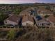 Aerial view of homes showcasing a neatly planned community with desert landscaping and mountain views at 26743 N 65Th Dr, Phoenix, AZ 85083