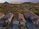 Breathtaking aerial view of a home surrounded by desert landscape and mountain views at 26743 N 65Th Dr, Phoenix, AZ 85083