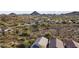 Expansive aerial view showcasing a community nestled in a desert landscape with mountain views at 26743 N 65Th Dr, Phoenix, AZ 85083