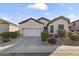 Charming single-Gathering home with a well-maintained two car garage and a beautifully landscaped front yard at 26743 N 65Th Dr, Phoenix, AZ 85083