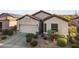 Inviting single-story home with low-maintenance desert landscaping and a convenient two-car garage at 26743 N 65Th Dr, Phoenix, AZ 85083