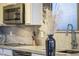 Modern kitchen featuring granite counters, stainless steel appliances and a sleek chrome faucet at 26743 N 65Th Dr, Phoenix, AZ 85083